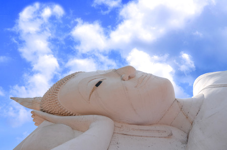 Buddha sculpture in the background sky and cloudsの写真素材