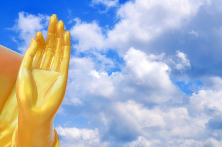 Buddha sculpture in the background sky and cloudsの写真素材