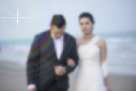 < mixed Blur the married couple walking on the beach happy and romantic love scene.の写真素材