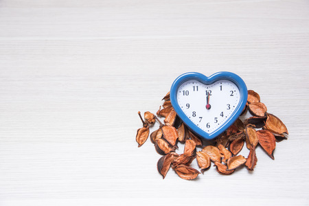 Clock, Straw flower on potpourri on Texture backgroundの写真素材