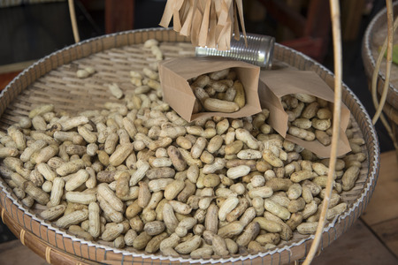 Peanuts lay on the back of a basket