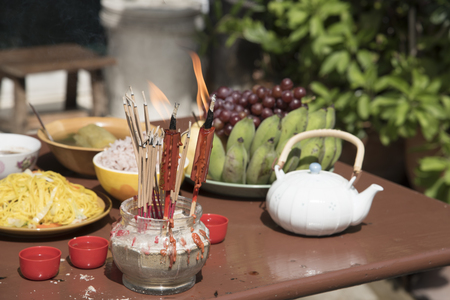 Sacrificial offering food for pray to god and memorial to ancestor in Chinese new year, Thailand.の写真素材