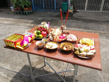 Sacrificial offering food for pray to god and memorial to ancestor in Chinese new year, Thailand.の写真素材