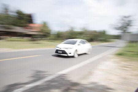 The car uses a blur speed as a background or wallpaperの写真素材