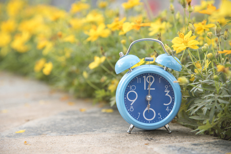 Blue clock in nature with copy space using as background or wallpaper.の写真素材