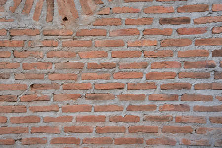 Red brick wall on old architectural surface wallpaper.