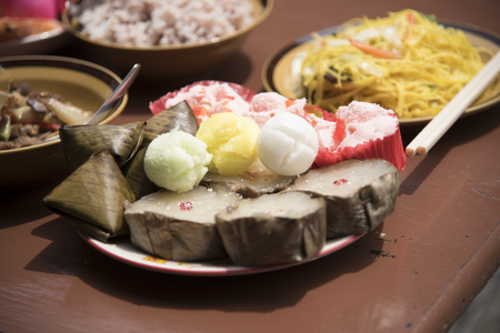 Sacrificial offering food for pray to god and memorial to ancestor in Chinese new year, Thailand.の写真素材