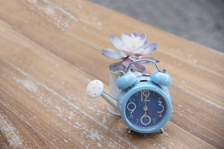 The blue clock and the blurry backgroundの写真素材