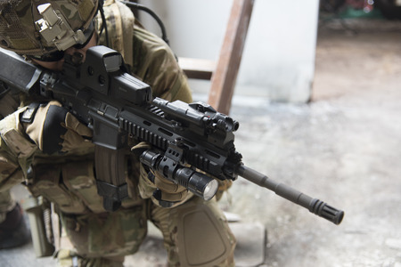 Military uniform and weapons on a wallpaper