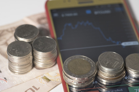 Trading Markets. Forex Currency Trading Concept with on a Mobile Phoneの写真素材