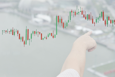 Trading graph on the and world map background,Business financial conceptの写真素材