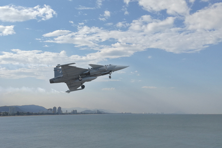 Gripen aircraft over the horizon as a background or wallpaper.のeditorial素材