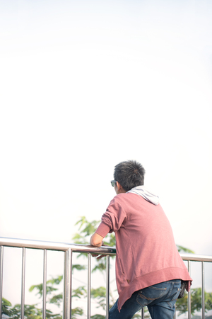 Men who do not see the face are watching the natural state.の写真素材