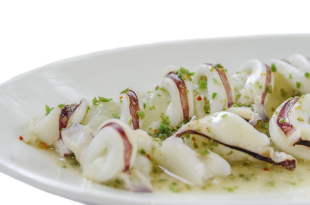 Squid topped with fresh seafood as background or wallpaper.の写真素材