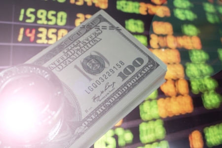 Currency, index investors in the stock market on the trading backgroundの写真素材