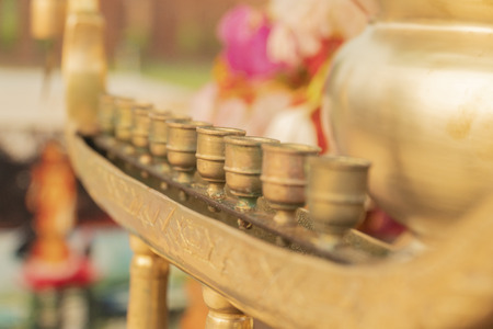 Brass candle holder on a blurred backgroundの写真素材