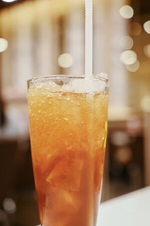 Iced tea with lemon on the tableの写真素材