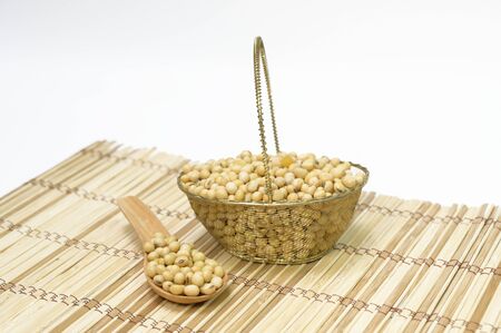 Soybean seeds on the floor, wood grain, white backgroundの写真素材