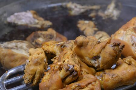 Kaki pork knuckle in a boiling potの写真素材