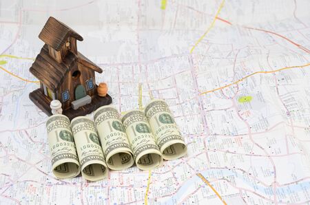 Home model with dollars and mapsの写真素材
