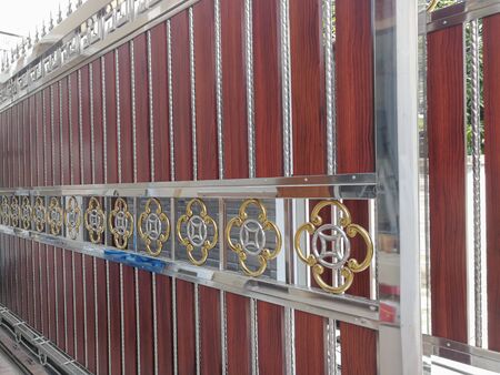 wrought stainless steel and wood fence
