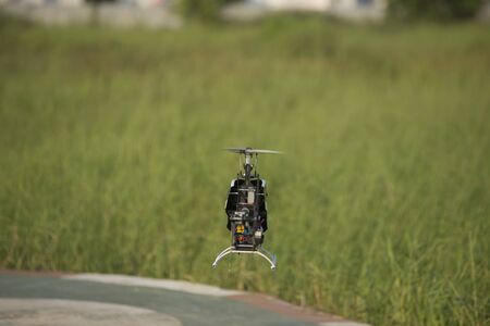 Radio controlled helicopter on the lawn backgroundの写真素材