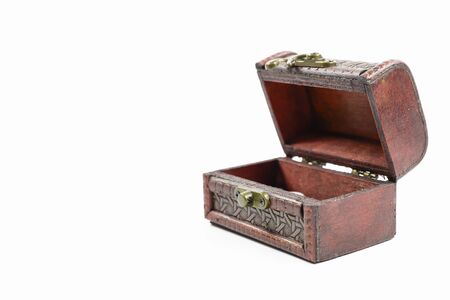 Mini treasure chest on a white background on a background with a copying areaの写真素材