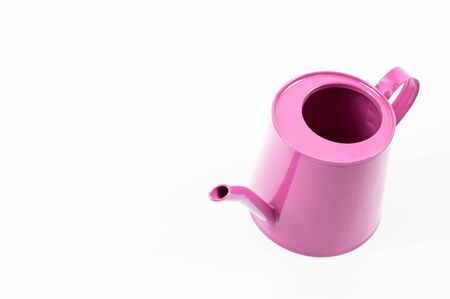 Watering can on a white background on a background with a copying areaの写真素材