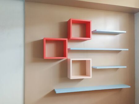 Furniture on a wooden background and colorful patternsの写真素材