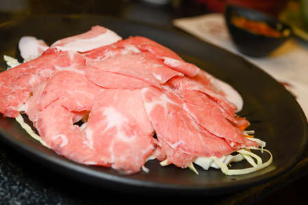 Lots of sliced fresh pork necks are gathered together on the food background.の写真素材