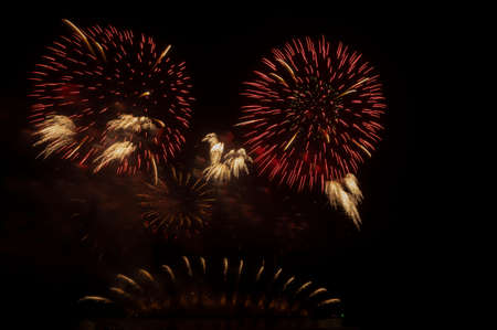 Fireworks and fireworks celebrating black background with copy spaceの写真素材