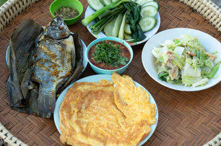 Thai food set, grilled fish with chili paste and omelet and stay fresh