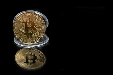Bitcoin gold coin with copy space and account technology concept on abstract backgroundの写真素材