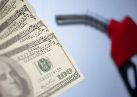Dollar bank money conceptualized with gas dispenser on abstract backgroundの写真素材