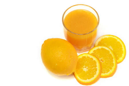 Orange fruit and glass on white background with copy spaceの写真素材