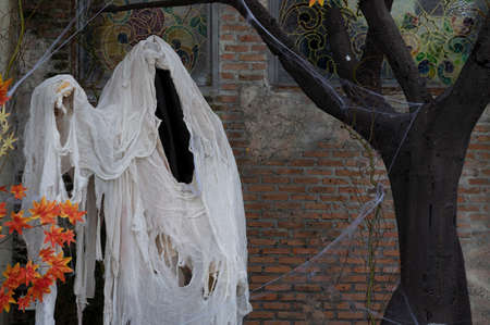 White hooded ghost Halloween grunge backgroundの写真素材