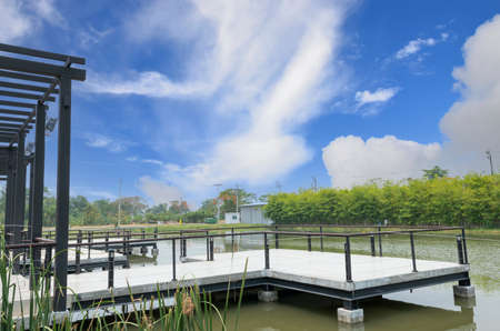 Waterfront terrace with space, empty tables, no people with gorgeous background views.の写真素材