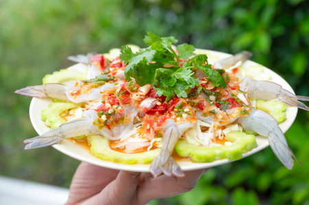 Shrimp in fish sauce stay green on plate on natural backgroundの写真素材