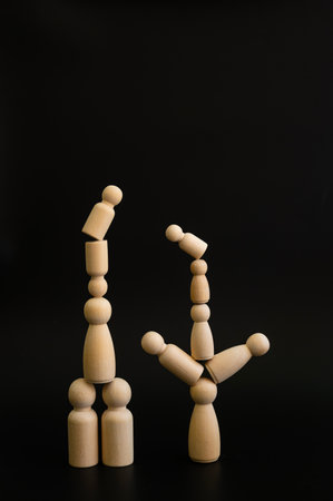 Person on stacked wooden blocks concept of balance with copy space for text on various important occasionsの写真素材