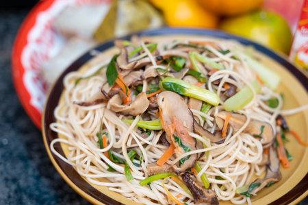 Fried Hong Kong noodles on healthy food backgroundの写真素材