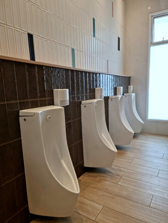 Inside the white urinal in the men's bathroom, structural material, background image / textureの写真素材