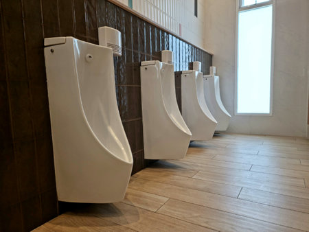 Inside the white urinal in the men's bathroom, structural material, background image / textureの写真素材