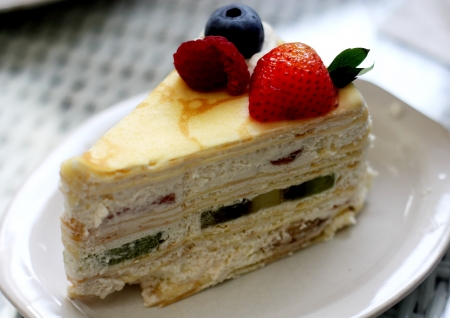 A piece of fruit crepe cakeの写真素材