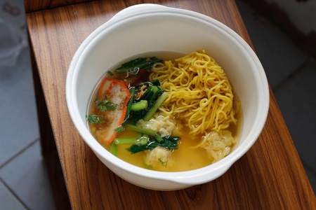 Chinese egg noodle soup with porkの写真素材
