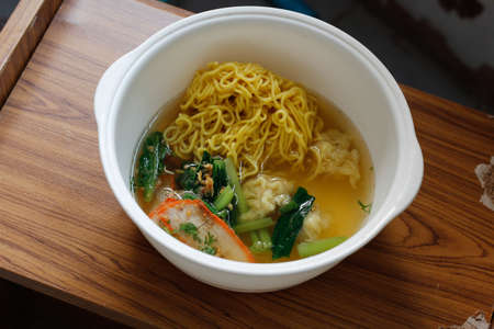 Chinese egg noodle soup with porkの写真素材