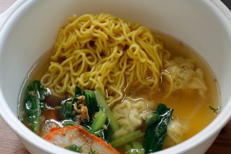 Chinese egg noodle soup with porkの写真素材