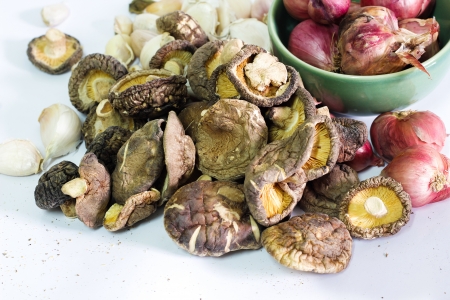 Shiitake mushrooms on the white background with Chili and Shallotsの写真素材