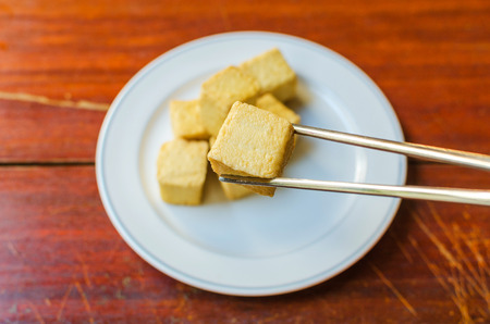 fish Tofu in the plate on a wooden table