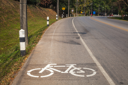 Cycle Lane with Cyclist in Mae Fah Luang University, Chiang-Rai Thailandの写真素材