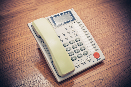 Old Telephone on the Table, Vintage color filter.の写真素材